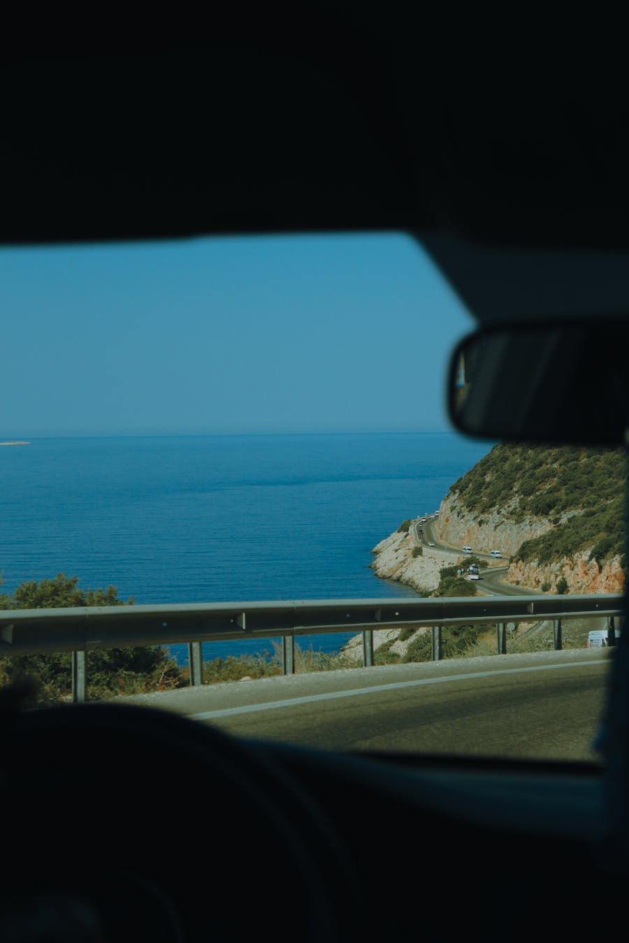 Serene coastal road drive with expansive ocean views